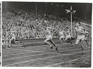 Runners Crossing Finishing Line at Olympics