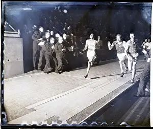 Runners Finishing a Race at Night