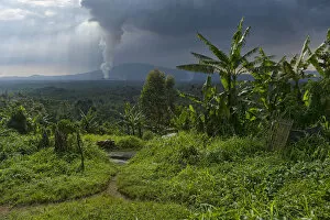 Images Dated 23rd February 2017: Rural dwelling with erupting Nyamuragira Volcano in background, Virunga National Park