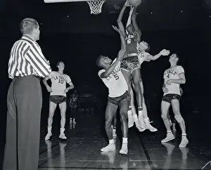 Bill Russell Prints: Bill Russell Blocking Tom Gola