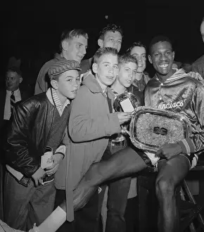 Bill Russell Prints: Bill Russell Holding His Trophies