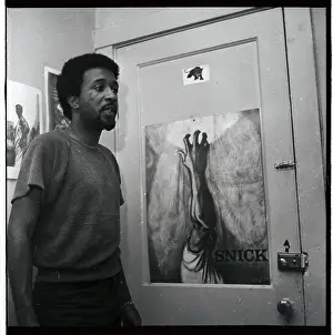 Russell Meek Standing by Artwork