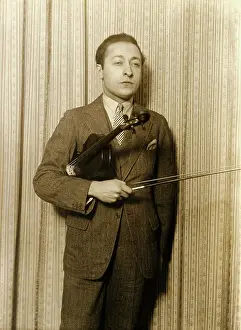 Russian American Violinist Jascha Heifetz Holding His Violin