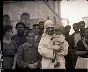 Refugee Prints: Russian Nurse Smiles As She Holds Child