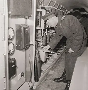 Russian Officer Reading a Fire Extinguisher's Label