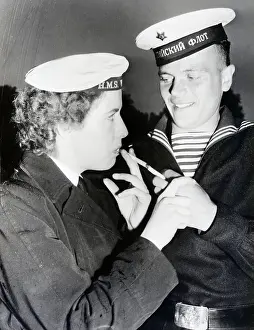 Russian Seaman Lights Cigarette For Lady