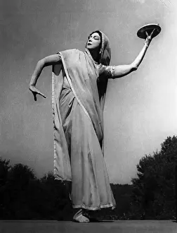 Ruth St. Denis in Silk Costume with Bowl in her Hand