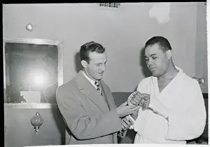 Stan Musial Prints: S. Musial Holds Joe Louis Right Hand