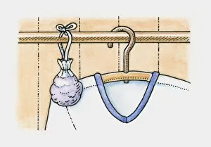 Pen And Ink Gallery: Sachet of lavender hanging on clothes rail in wardrobe, next to a shirt