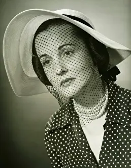 Wide Brim Prints: Sad woman in hat with veil posing in studio, (B&W), (Close-up), (Portrait)