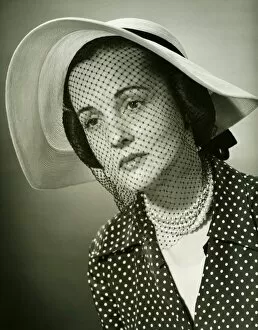 Pearl Collection: Sad woman in hat with veil posing in studio, (B&W), (Close-up), (Portrait)