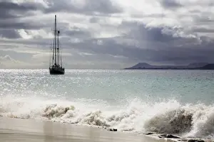 Seaboard Prints: Sailing boat on the Playa de Mujeres beach near Playa Blanca