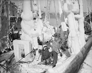Sailor Chopping Ice Off of a Ship