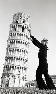 A Sailor Holds Up the Leaning Tower of Pisa