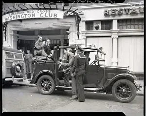 Red Cross Prints: Sailors and Soldiers in and Around a Car