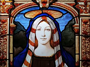 Saint Mary veiled and crowned on an abandoned stained glass window
