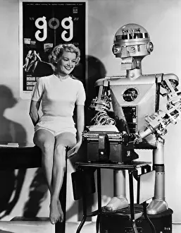 Typing Prints: Sally Mansfield Sitting Beside Garco Robot