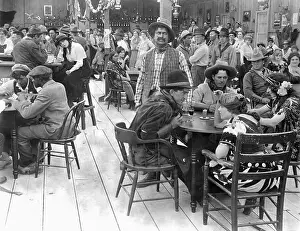 Saloon With Cowboys And Girls Drinking