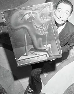 Spanish Prints: Salvador Dali Holding Soft Self-Portrait by Salvador Dali