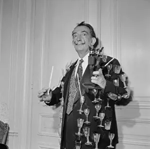 Salvador Dali Wearing Jacket Covered in Glasses