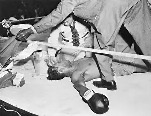 Unconscious Prints: Sam Baroudi Lying Unconscious in Ring