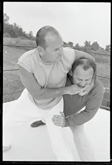 Sam Sheppard Putting Headlock on His Trainer