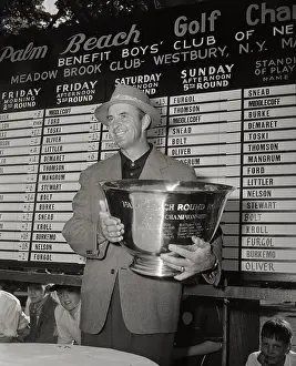 Sam Snead Standing with Trophy Before Scoreboard
