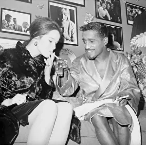 Sammy Davis Jr. Offering Light to Geraldine Chaplin