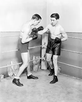 Prints of CHICAGO, IL - FEBRUARY 2: Sammy Mandell (right) the former world lightweight champion sparring with Jackie Fields at Mullen's Gym in Chicago, Illinois, February 2, 1928 In the Ring: The Art of Boxing: Sammy Mandell