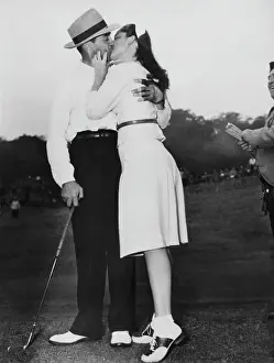 Sammy Snead and Golf Open Hostess Kissing on the Green