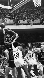 Prints of American basketball player George Gervin (#44), of the San Antonio Spurs, leaping with the ball during NBA playoffs against the Boston Celtics at the Boston Garden stadium, Massachusetts, 1977 Courtside Vibes: Stunning Basketball Prints: San Antonio Spurs Vs Boston Celtics