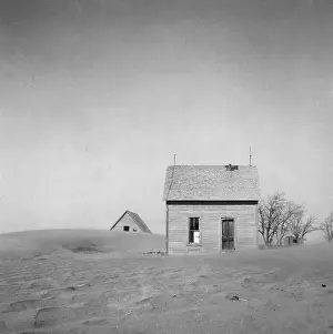 Dust Prints: Sand Whirling Around House And Barn