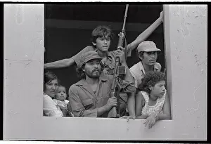 Sandinista Soldier with Family Holding Gun