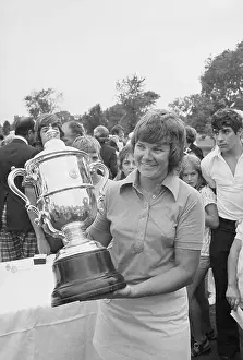 Sandra Haynie Holding Trophy