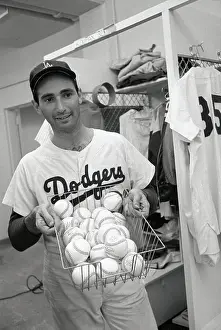 Sandy Koufax Holding Basketfull of Baseballs