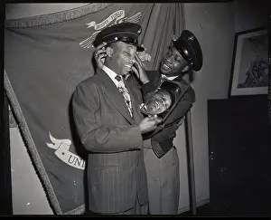 Sandy Saddler Trying On Marine Corps Cap