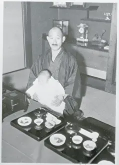 Sankichi Takahashi Holding His Grandson