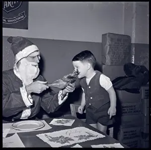 Santa and Boy Eating Turkey Leg