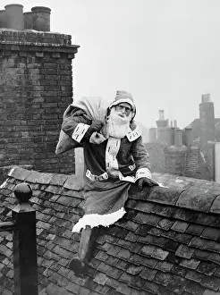 Santa Claus Seated on Rooftop