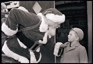 Touching Prints: Santa Claus and Young Boy