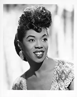 Prints of NEW YORK - CIRCA 1943: Jazz singer Sarah Vaughan, who possessed one of the finest vocal instruments in the history of jazz, poses for a publicity shot circa 1943 in New York, New York The Divine One: Sarah Vaughan