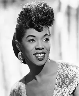 Prints of NEW YORK - CIRCA 1943: Jazz singer Sarah Vaughan, who possessed one of the finest vocal instruments in the history of jazz, poses for a publicity shot circa 1943 in New York, New York The Divine One: Sarah Vaughan
