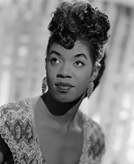 Prints of NEW YORK - CIRCA 1943: Jazz singer Sarah Vaughan, who possessed one of the finest vocal instruments in the history of jazz, poses for a publicity shot circa 1943 in New York, New York The Divine One: Sarah Vaughan