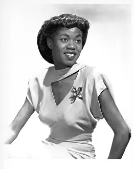 Prints of NEW YORK - CIRCA 1948: Jazz singer Sarah Vaughan, who possessed one of the finest vocal instruments in the history of jazz, poses for a publicity shot circa 1948 in New York, New York The Divine One: Sarah Vaughan