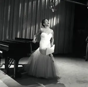 Prints of NEW YORK - NOVEMBER 10, 1959: Singer Sarah Vaughan performs a song on the Ed Sullivan Show on November 10, 1959, in New York, New York. (Photo by Steve Oroz/Michael Ochs Archives/Getty Images) The Divine One: Sarah Vaughan On The Ed Sullivan Show