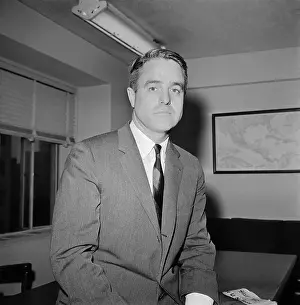 Sargent Shriver Sitting on Desk