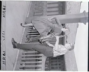 Saxophonist Playing to Model on Porch