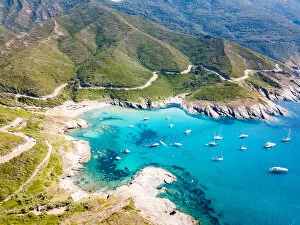 Aerial Collection: Scenic seascape and road near Anse d Aliso, Corsica, France