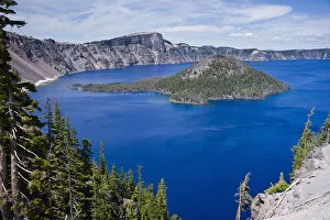 Cloudy Sky Collection: Scenic view of Wizard Island, a volcanic cinder cone, in Crater Lake, Crater Lake National Park