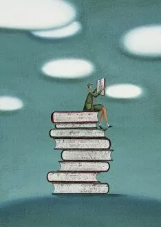 Schoolboy Sitting on a Stack of Books Reading